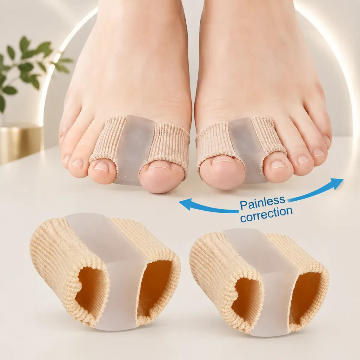 Both feet wearing beige separator tubes on the big toes, with two spare tubes beside them